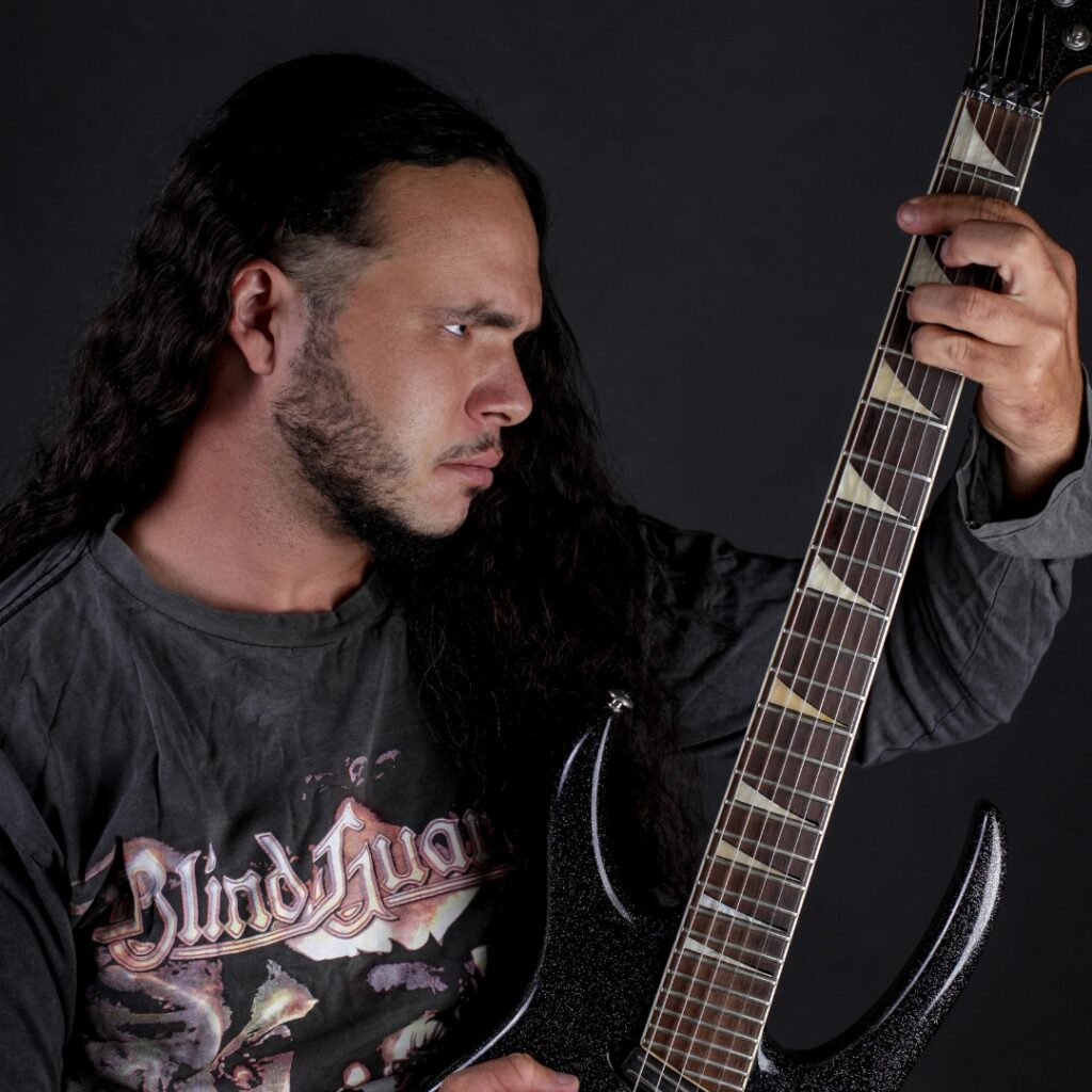 man-with-long-hair-playing-heavy-metal-guitar